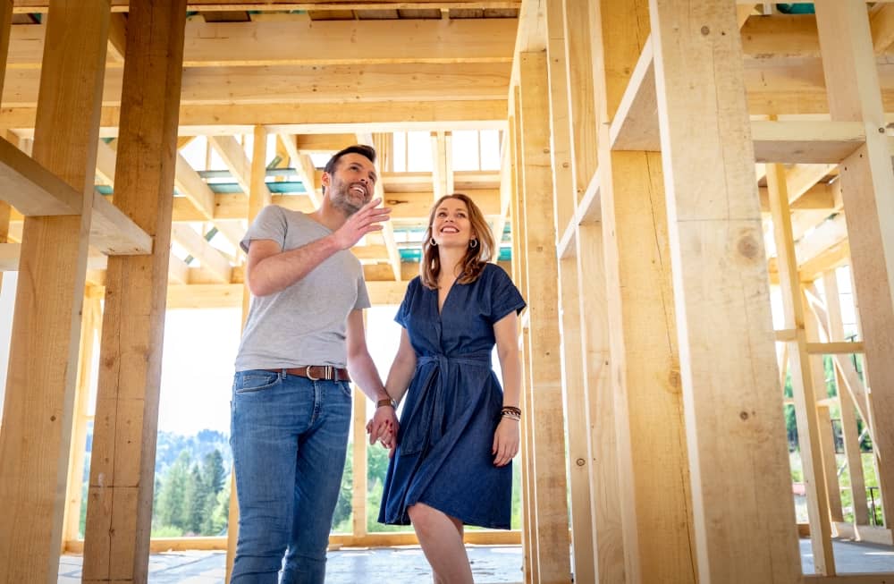 Couple visiting house under construction.